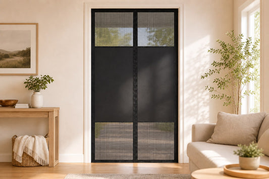 A black magnetic mesh screen door neatly hung on a bright living-room doorway