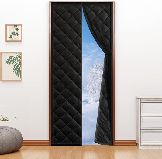 Fillis black quilted thermal insulated door curtain hung on a standard interior doorway, open to a snowy view