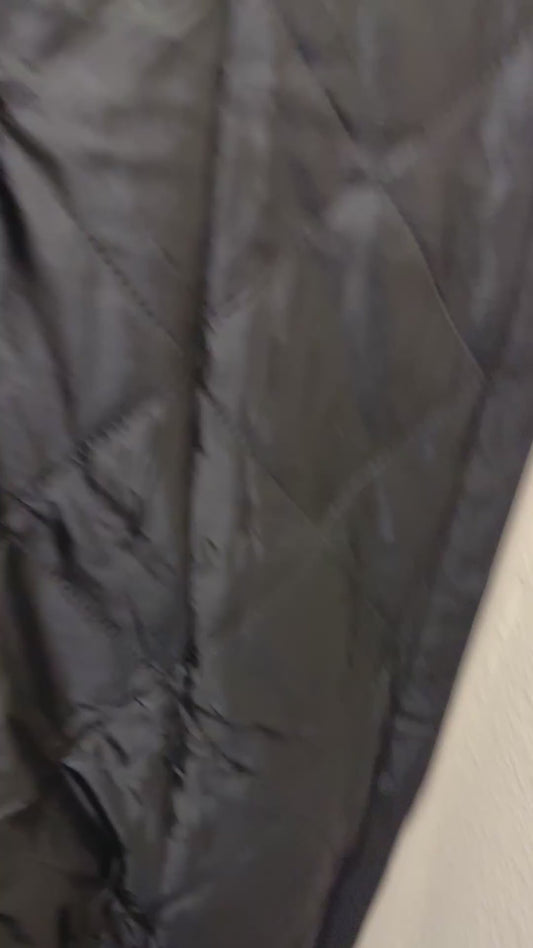 Customer video: Fillis thermal insulated door curtain on a 36 x 82 door, magnetic seam closing behind her